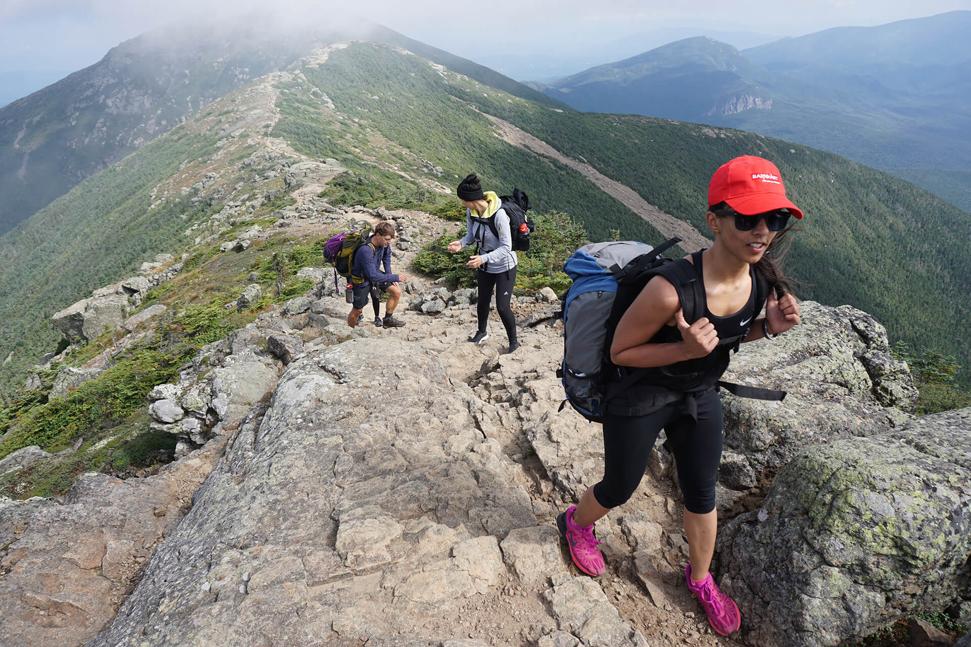 IDM students hiking up a trail in New Hampshire